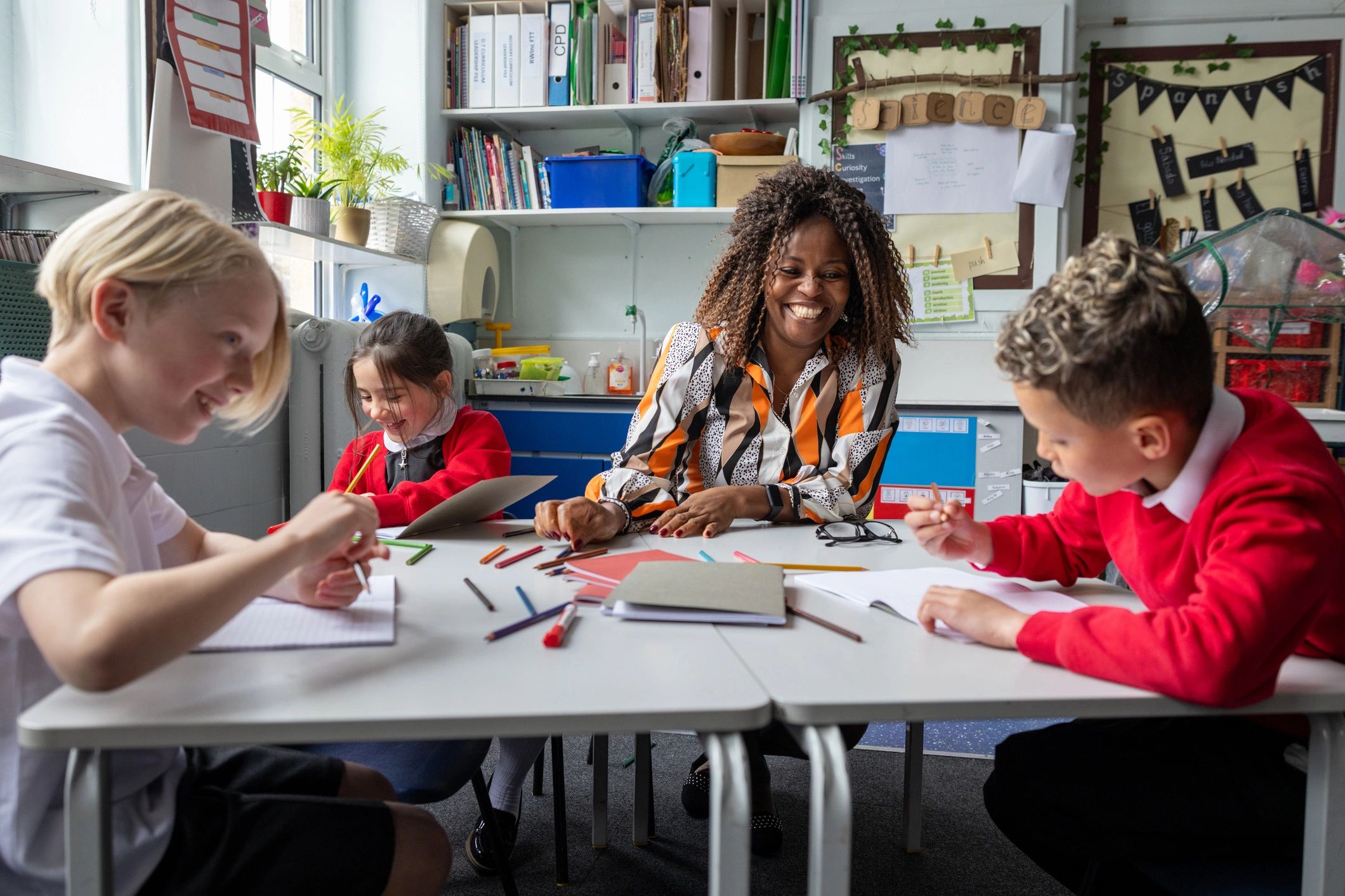 Teacher working with students during a lesson